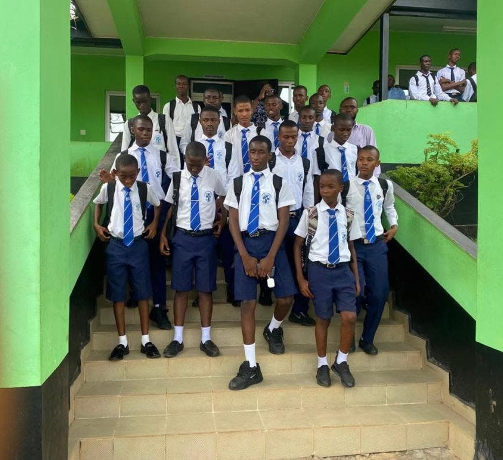 Students in front of the school building